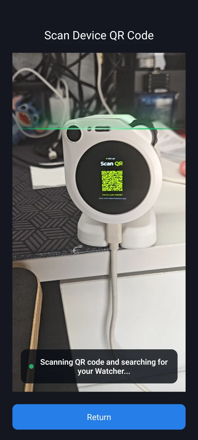 The app scans the QR code and searches for the device